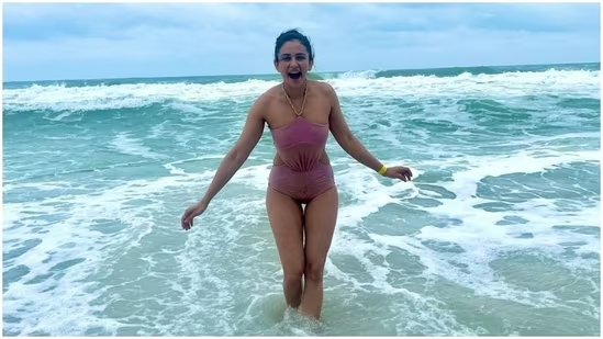 ‘Beach bum’ Rakul Preet Singh in a lavender swimsuit enjoys a dip in the sea.