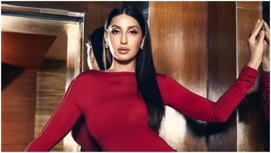 Nora Fatehi will spice up your feed in red backless dress perfect for ringing in the New Year.